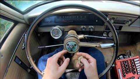 Removing a steering wheel on a 60's GM vehicle.