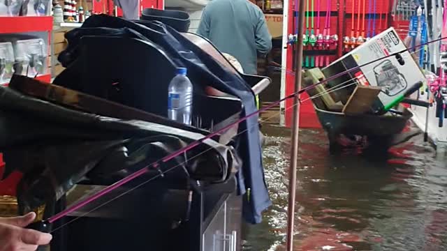 Fishing in a Flooded Boat Shed