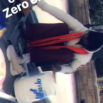 Street performer makes beats out of pots and pans in zero degree weather on a sidewalk