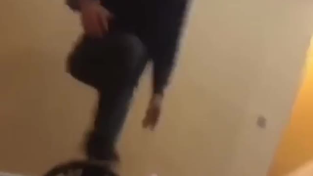 Man gets hyped up to balance standing on a chair, man falls and slams face into table
