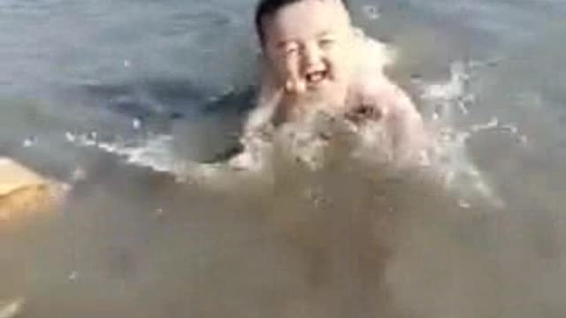 Video of a beautiful child playing in the sea