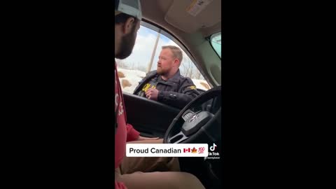 officer stops protester