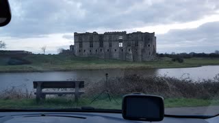 Coffee in the car at Carew castle. pembrokeshire . Wales during a sunset .