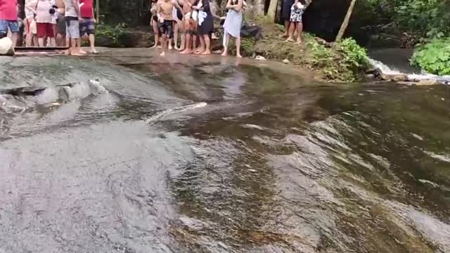 Surfing Down Slick Waterfall Rocks