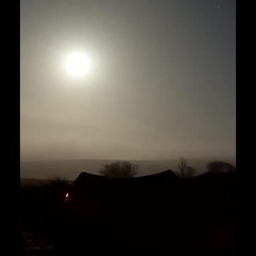 Nightlapse. Moon over a lightweight trekking pole tent. Dartmoor