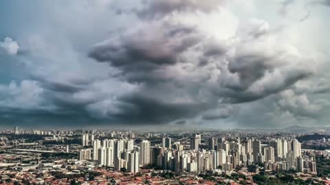 Stunning Aerial View of Clouds Above Cityscape