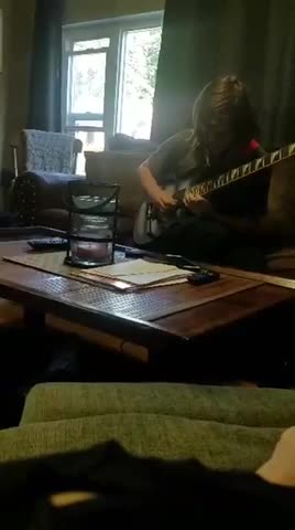 John sweeping on guitar