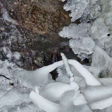 Icicles on a small river.