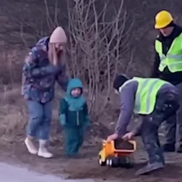 Boy and his new dump truck get their first load of soil - little big things in life.