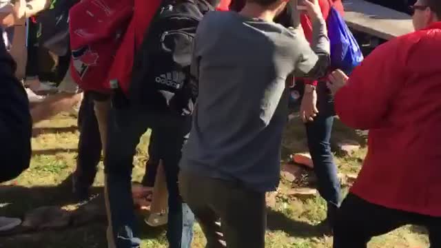 Grey pants elbow drops into crowded table