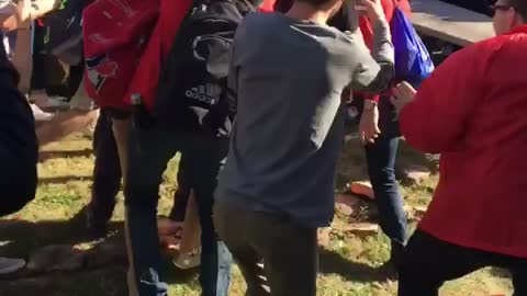 Grey pants elbow drops into crowded table