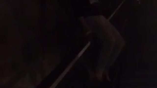 Girl sliding down railing falls down