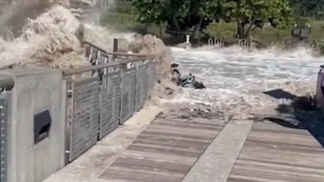 As forecasters predicted huge swells of waves, some bystanders in Miami