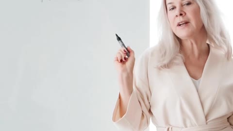 Teacher Holding a Marker While Talking