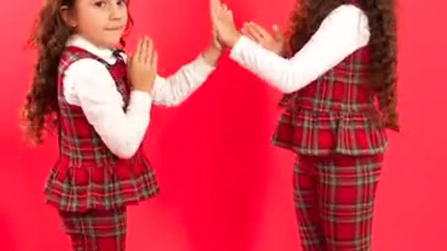 Little Girls Playing Pat-A-Cake Together