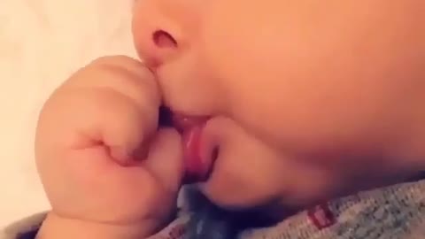 Finger eating baby