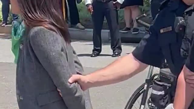 Why is AOC Pretending to be Handcuffed?