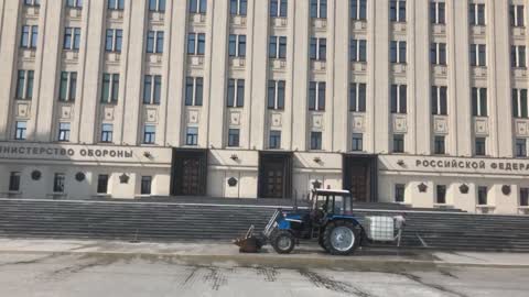 Washing tractor near Ministry of Defense Russia