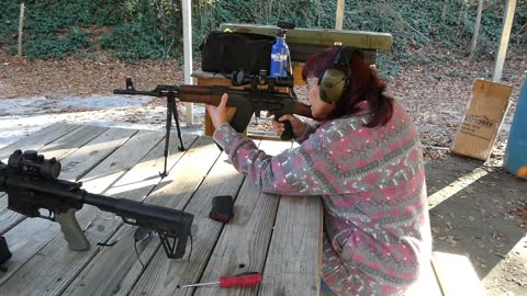 Sweety with her Scoped AK. C39V2, 2 inch targets at 50 yards.