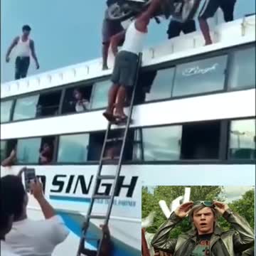 Carrying a motorcycle up a ladder using only his head..impressive