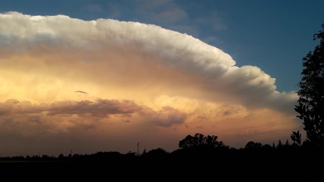 Beautiful Cumulonimbus Storm Illuminates in Sunset