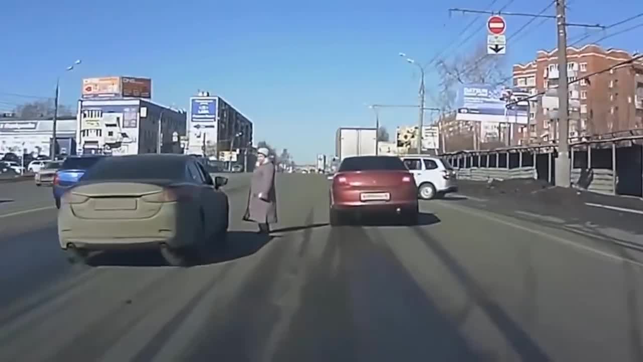 Woman crossing street at Random spot causing chaos