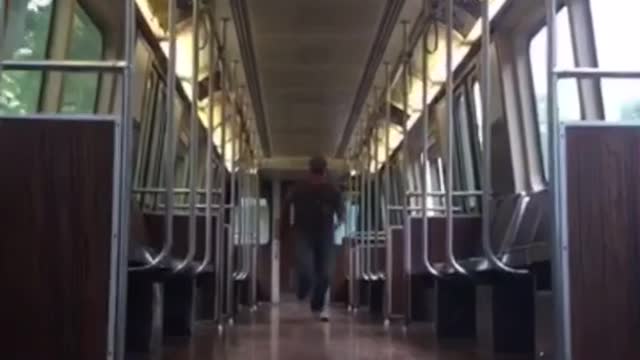 Guy slides to camera on wood floor train