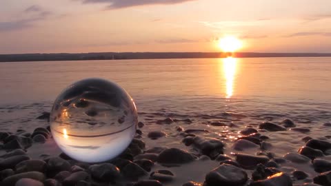 See the glass ball on the shore