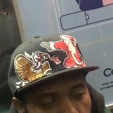 Man with turkey and santa on black hat