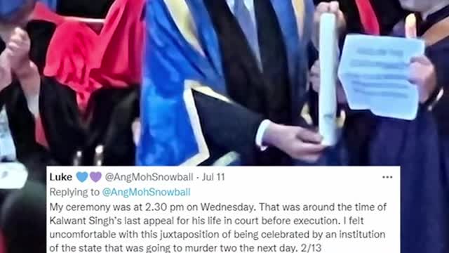 NUS student holds 'abolish death penalty' sign during grad ceremony