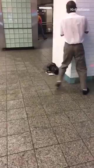 Old man dances in subway station