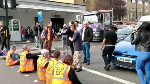 Environmentalist protesters blocking Harleyford Street in London