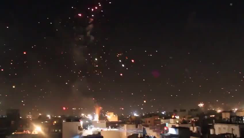 Beautiful lanterns and fire crackers in the sky at night