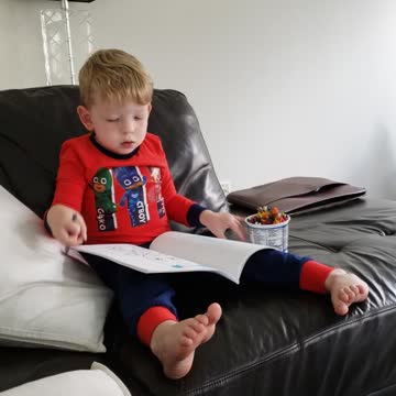 Wee man coloring on a Sunday