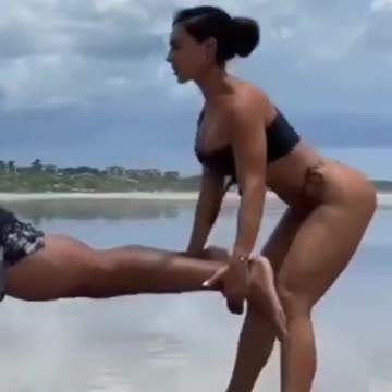 Partner Workout At Beach
