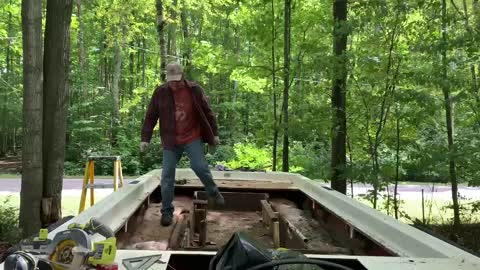 Craig taking out the floor of the boat