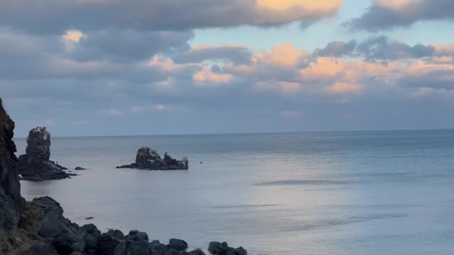 The sea of Jeju Island at sunset