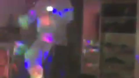 Music guy grey hoodie dancing with disco lights