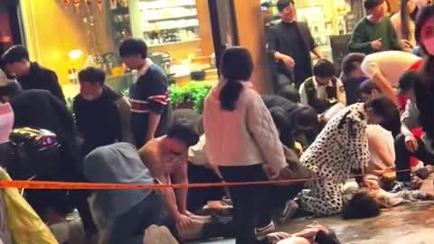 Dozens of people receive CPR in the streets of Seoul.