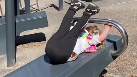 Little Girls Performs Various Exercises While Training Outside In the Park