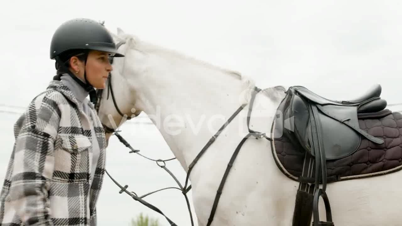 Beautiful Woman Getting Off A Horse