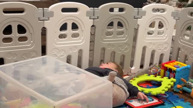 Wild Child Playing in Playpen Tumbles off Plastic Box