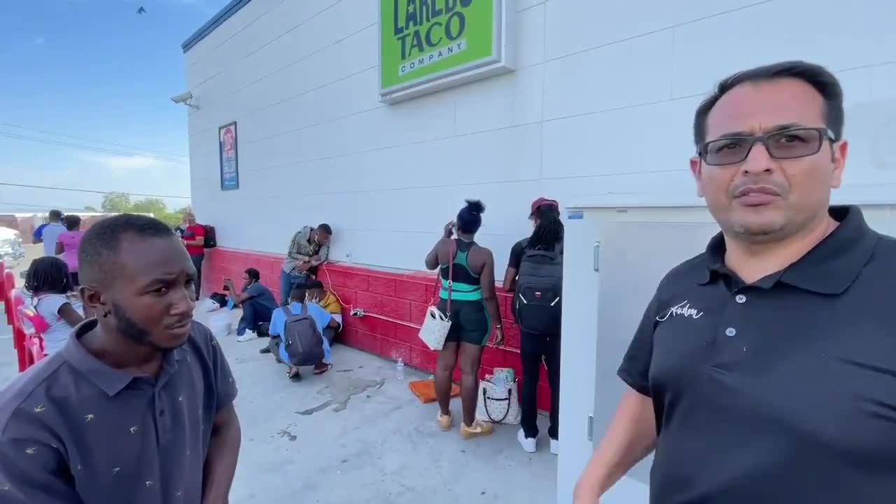 Border Patrol Dropping Off Haitians at a Bus Stop