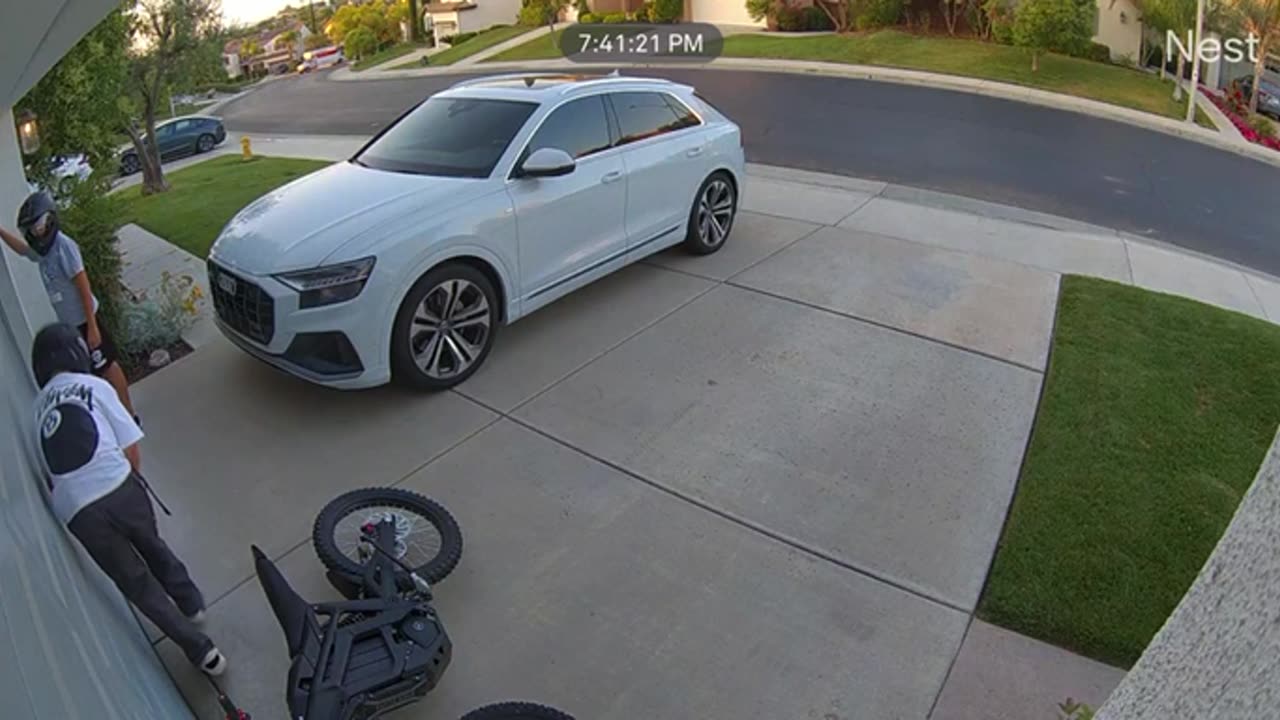 Kid Drives Dirt Bike Into Garage Door