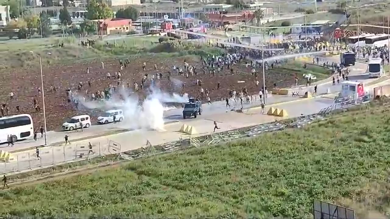 Turkish security forces disperse an angry crowd outside the U.S. military base Incirlik in Adana.