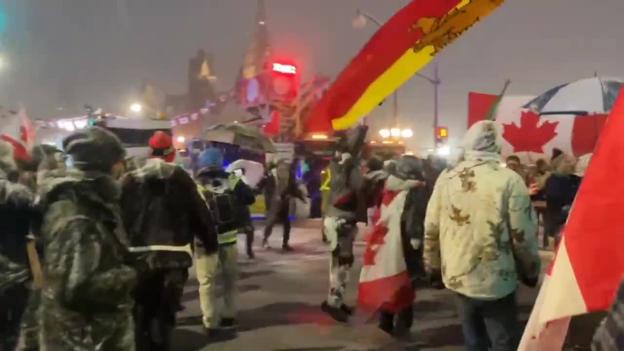 Snow lashing down on the Ottawa convoy for freedom but they're keeping warm