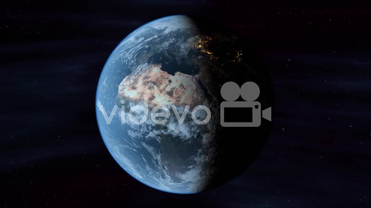 Planet Earth In Space Rotates From Day Into Night As City Lights Turn On (Loop)