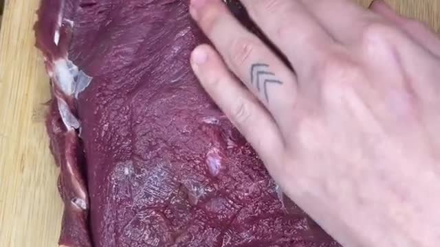 Cleaning up a bottom round roast from a deer