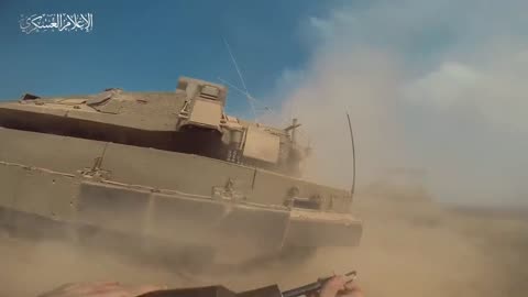 Hamas fighters climb out of tunnel and attack Israel tank