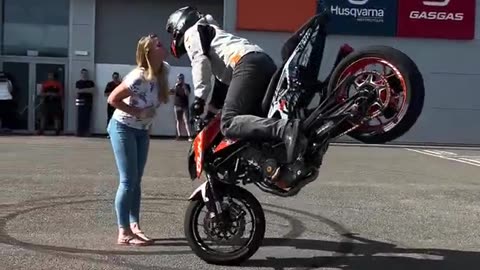 Surprise KTM stunt show with stoppie